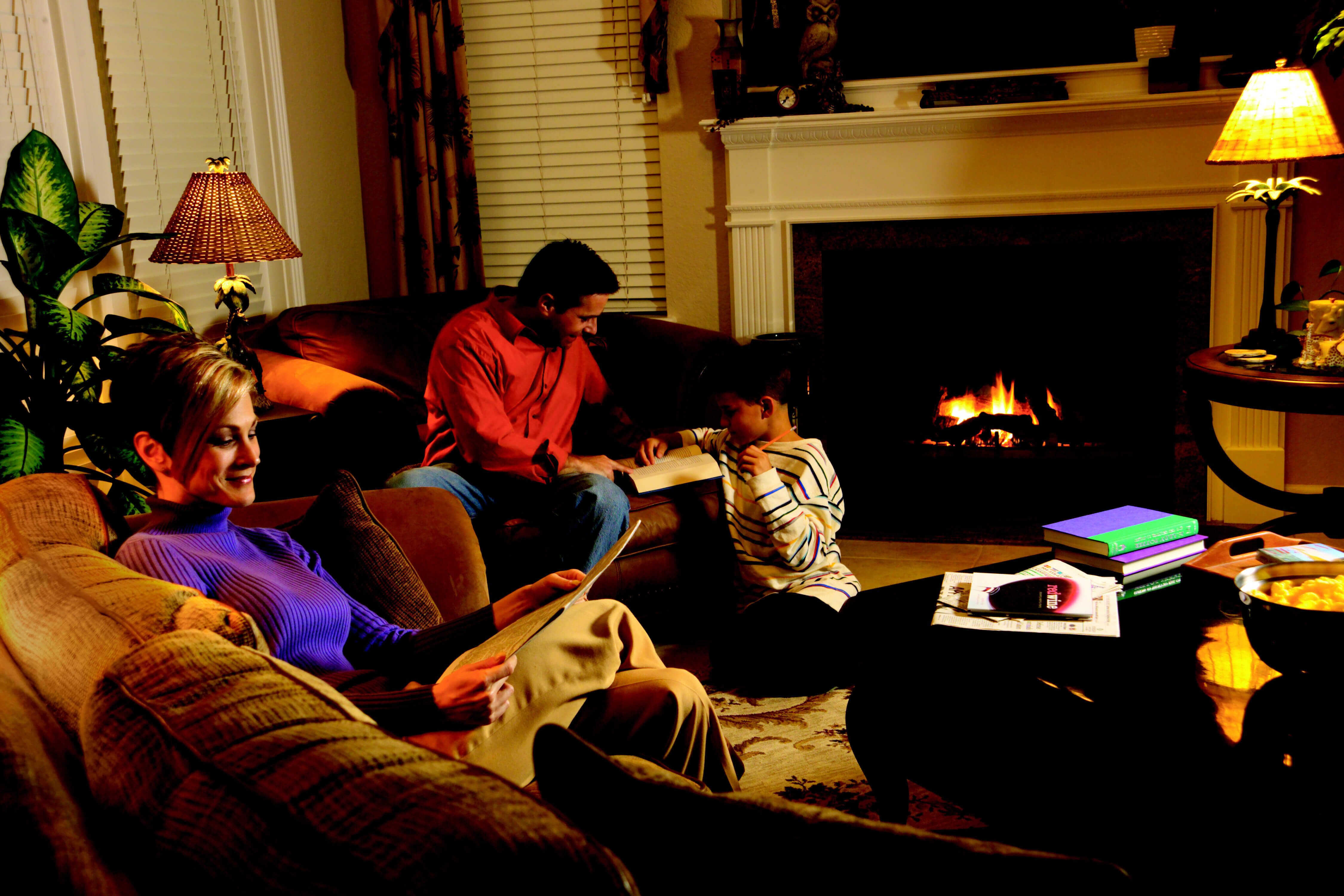 Image of a family in front of a propane powered fireplace